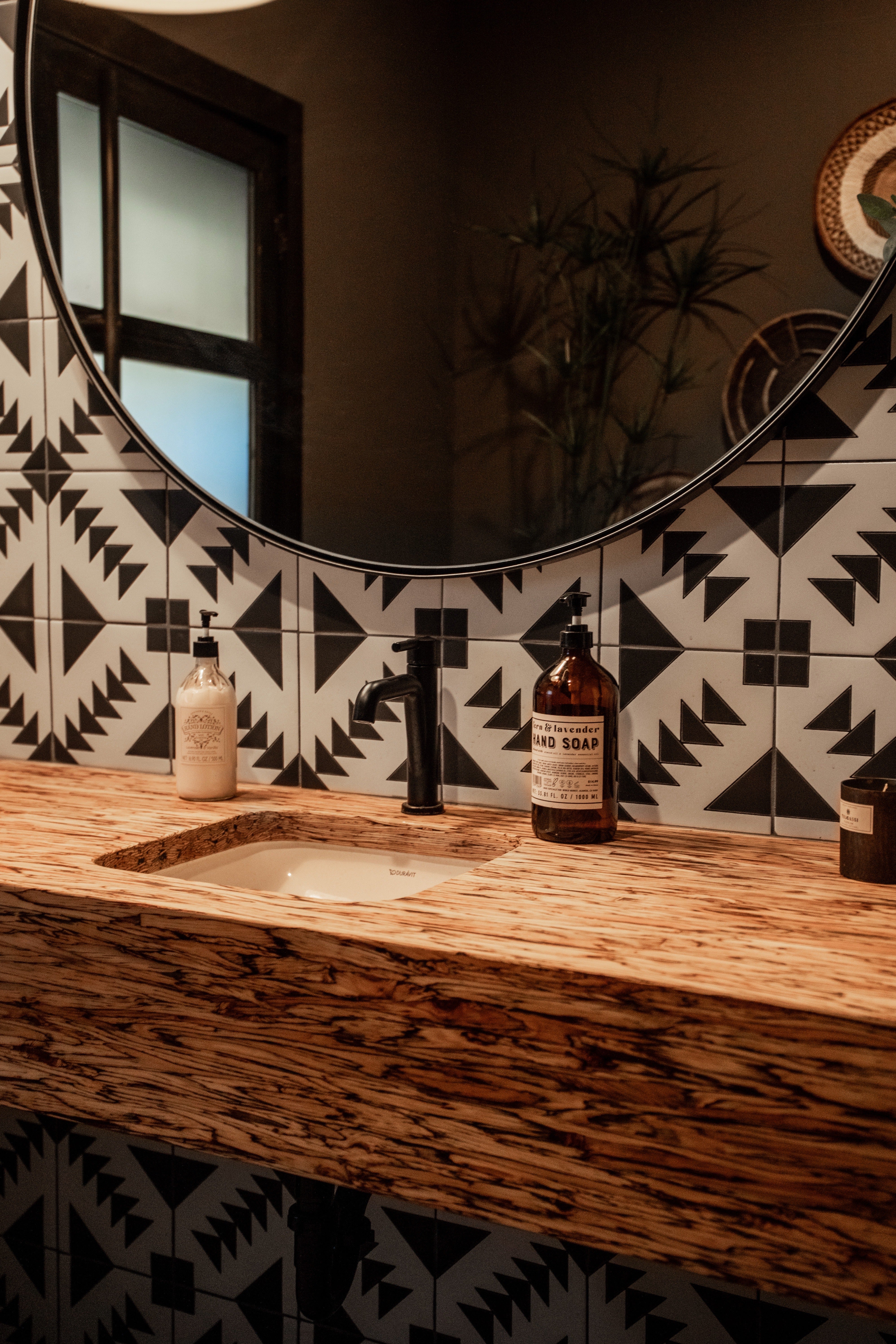 Close up of Black and White Geometric Tile in our T-22 pattern as a bathroom sink backsplash