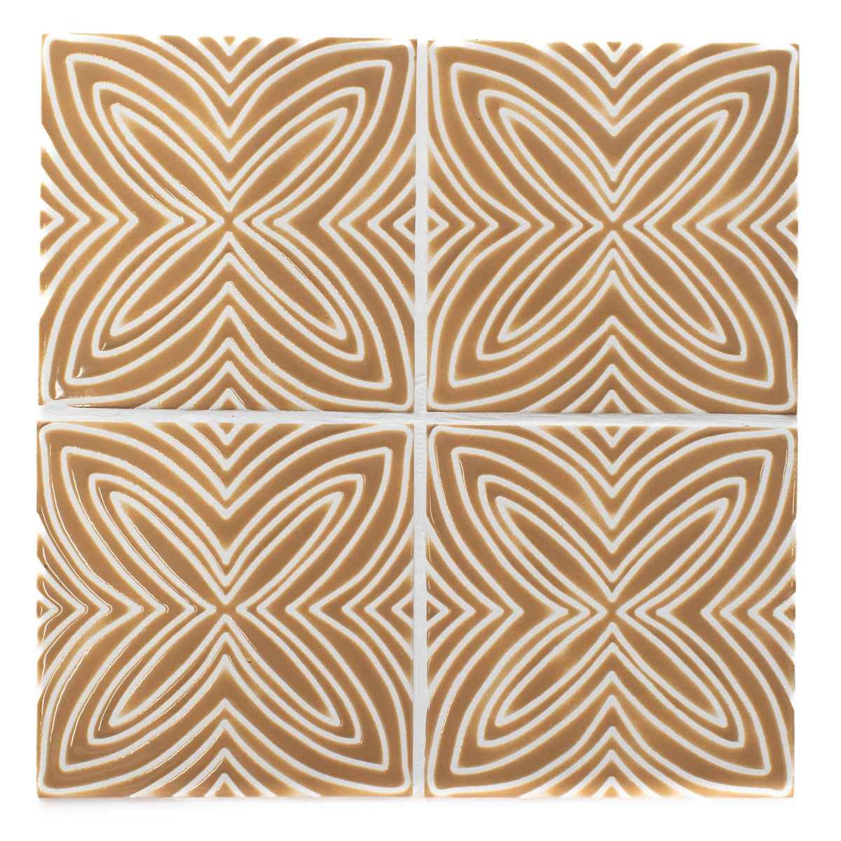 Four square tiles with a geometric pattern on a white background