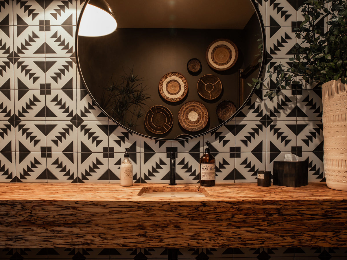 Front view of Black and White Geometric Tile in our T-22 pattern as a bathroom sink backsplash