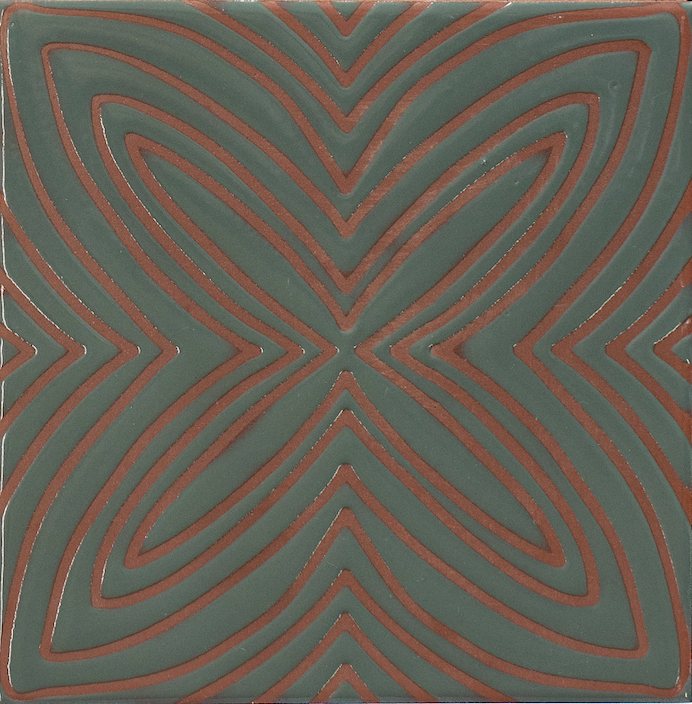 Tile with a geometric pattern of concentric circles on a green background